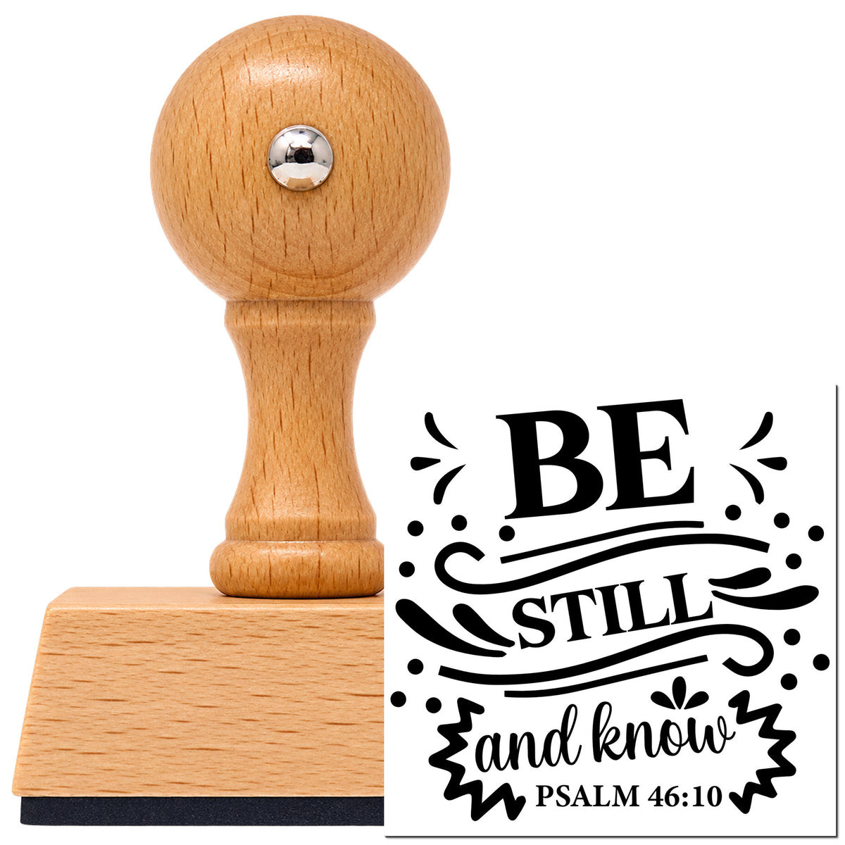 Vintage Pro beech wood stamp with a round knob handle, shown with its black Be Still And Know Flourishes imprint on white.