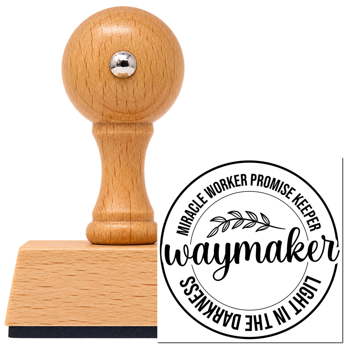 Vintage Pro beech wood stamp with a round knob handle, shown with its black Waymaker Leaf Emblem imprint on white.