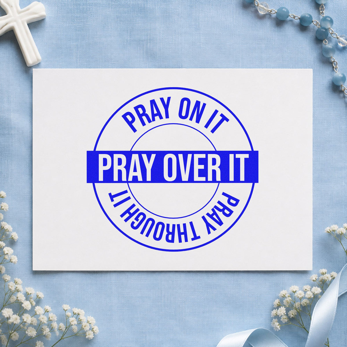 Pray on over Through Circle craft stamp imprinted in blue ink on paper, a design suited to tee transfers.