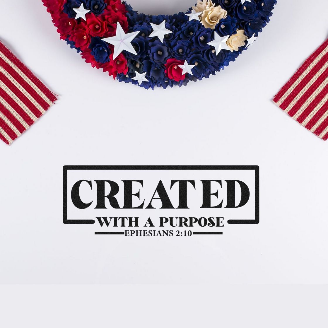Black stamp seal reading Created with a Purpose, with red, navy, and cream patriotic floral wreath and striped accents.