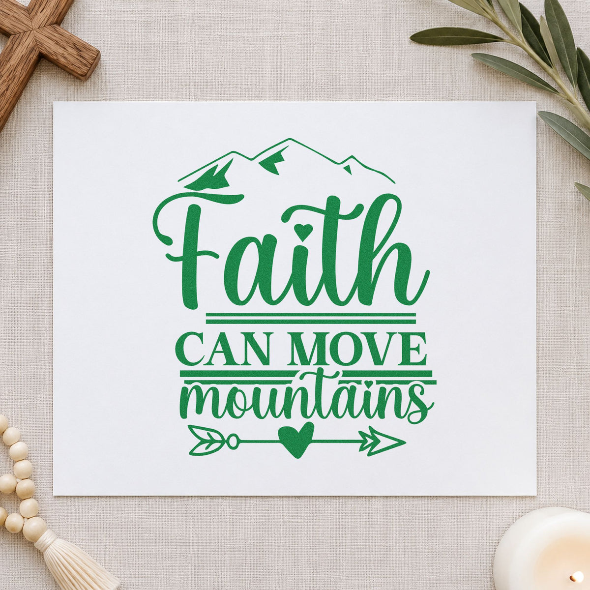 Faith Moves Mountains Heart Arrow craft stamp imprint in green ink on a handmade project, one idea being trailhead journal covers.