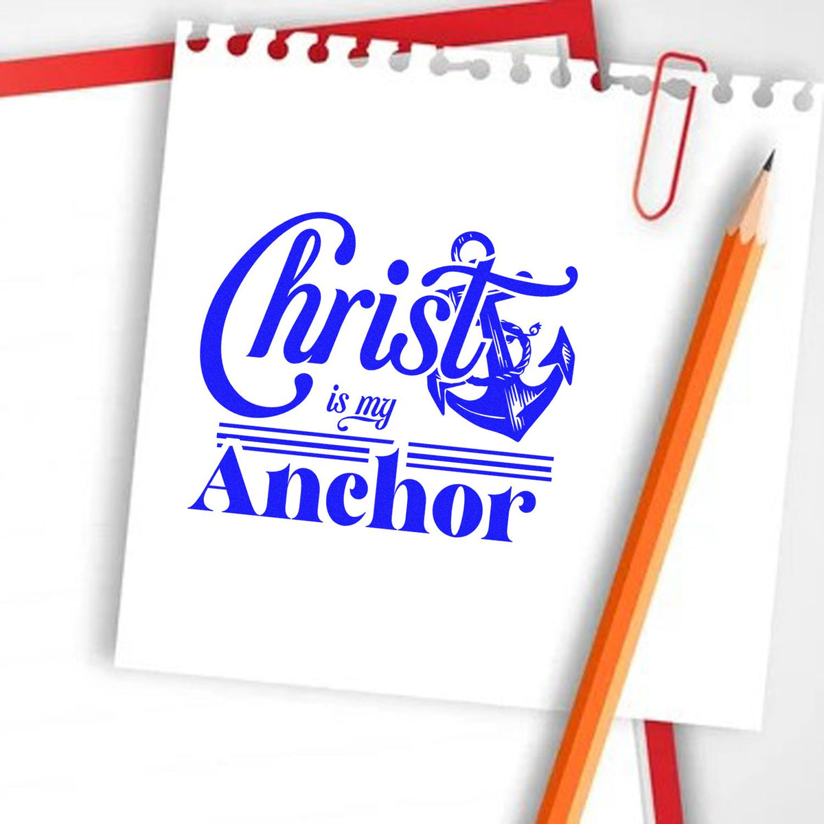 Blue Christ is my Anchor stamp/seal design on white paper, with anchor graphic, red clip, and orange pencil.