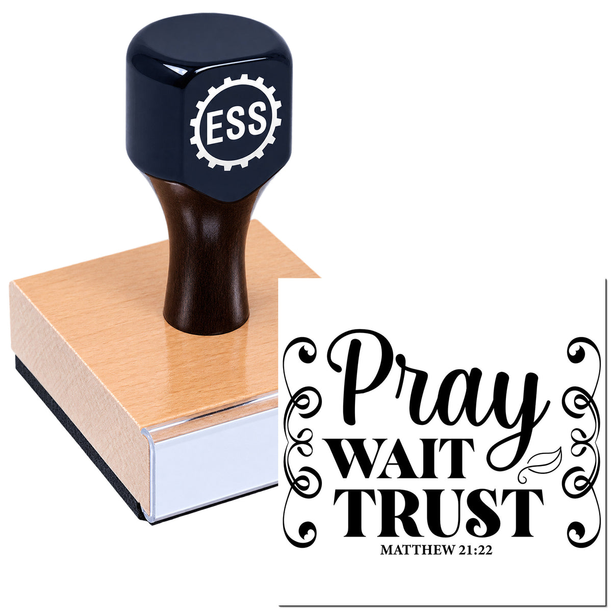 Navy ESS rubber stamp on wooden base beside black decorative seal reading "Pray, Wait, Trust" with Matthew 21:22.