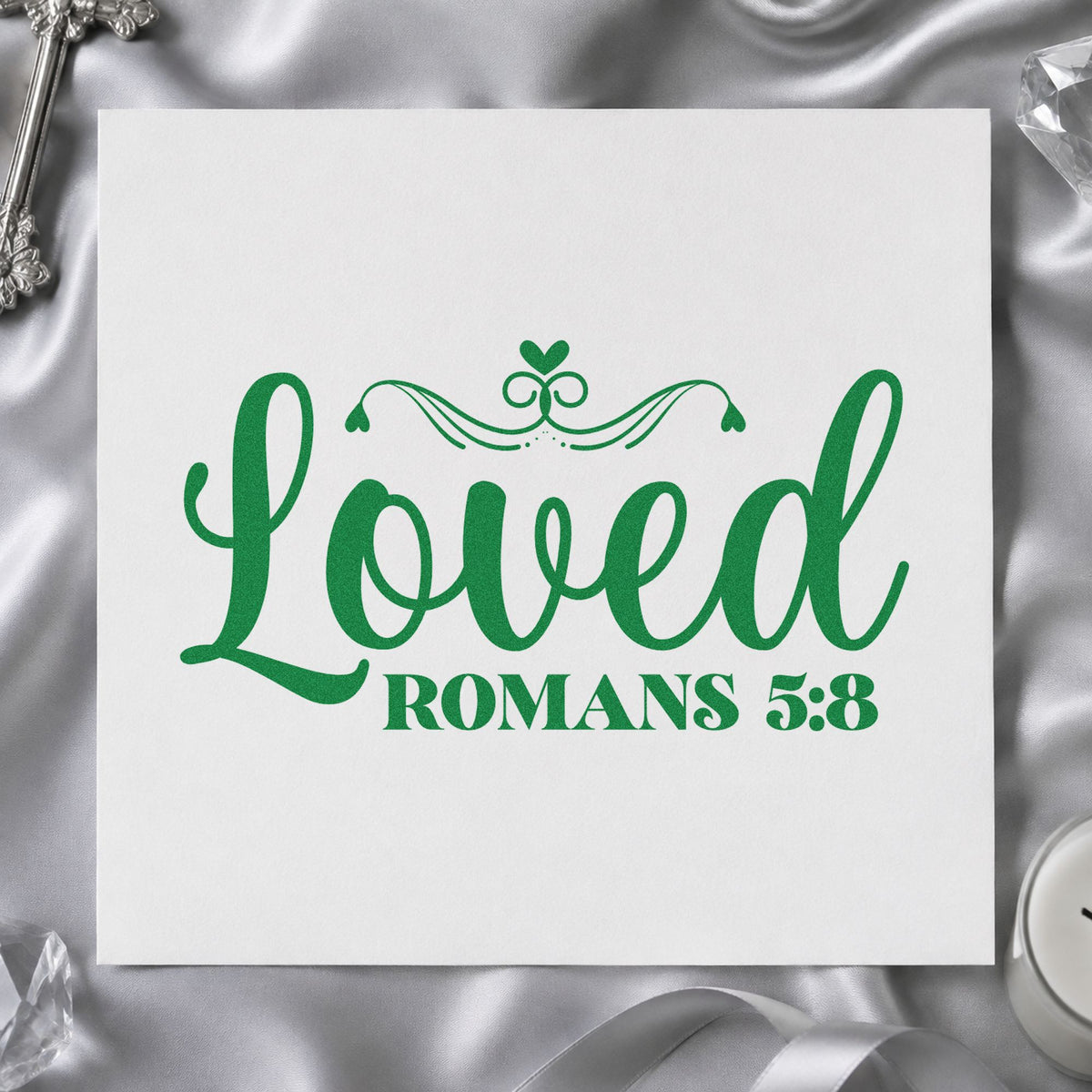 Loved Romans Five Eight craft stamp imprint in green ink on a handmade project, one idea being newborn gifts.