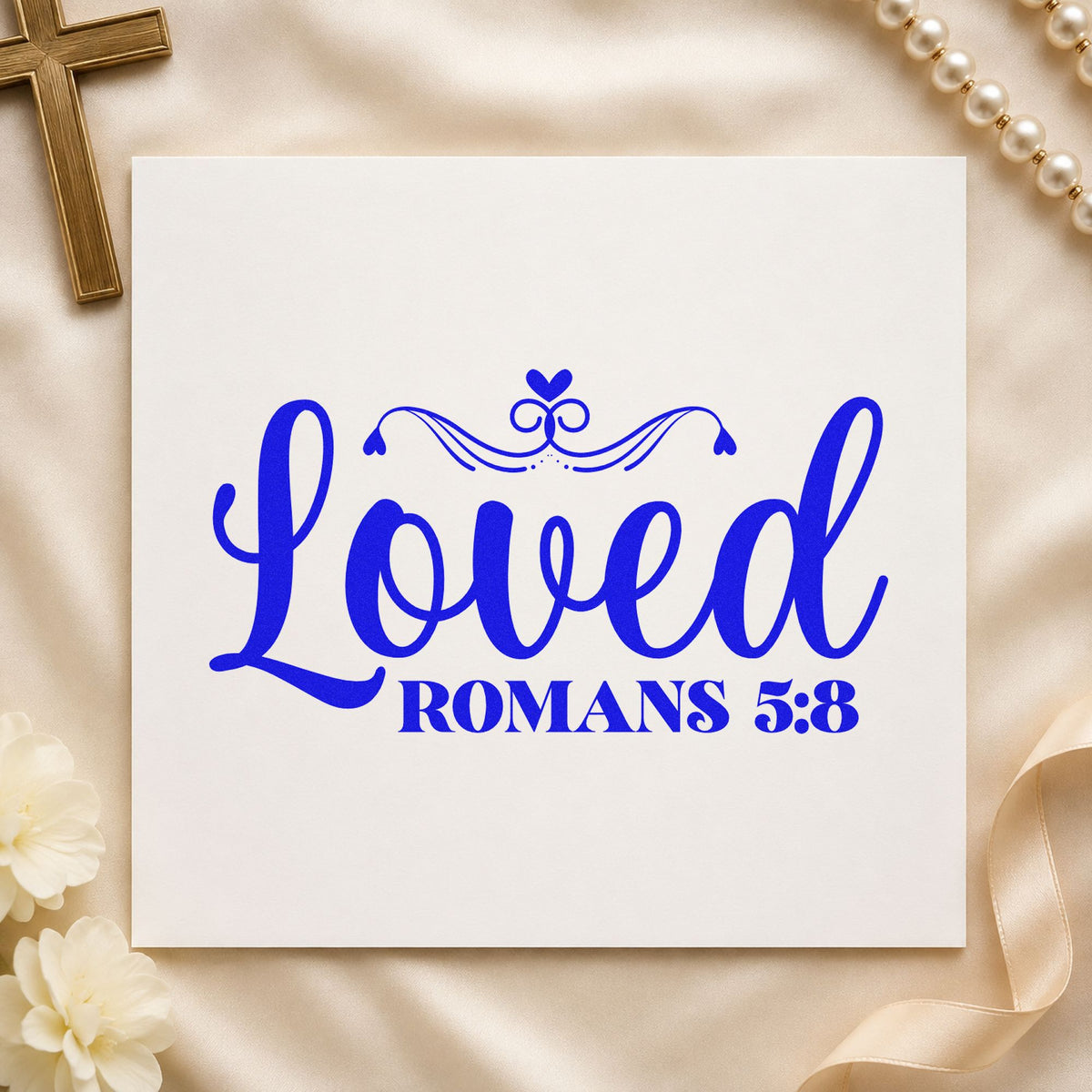Loved Romans Five Eight craft stamp in blue ink on cardstock, an easy option for onesie stamping.