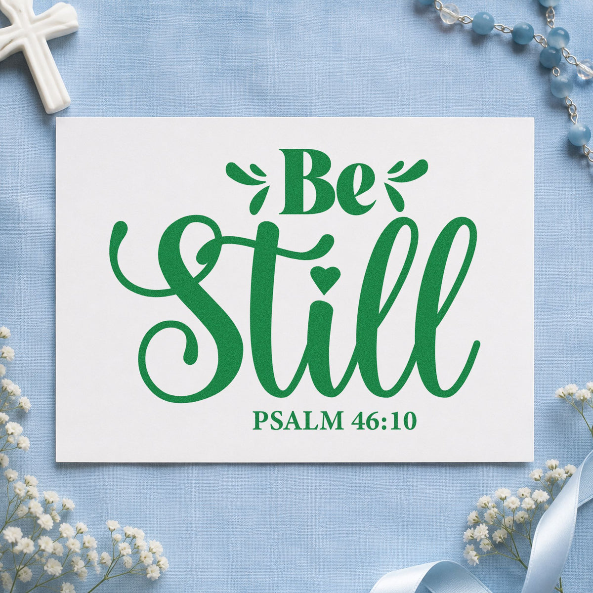 Be Still craft stamp imprint in green ink on a handmade project, one idea being yoga class welcomes.