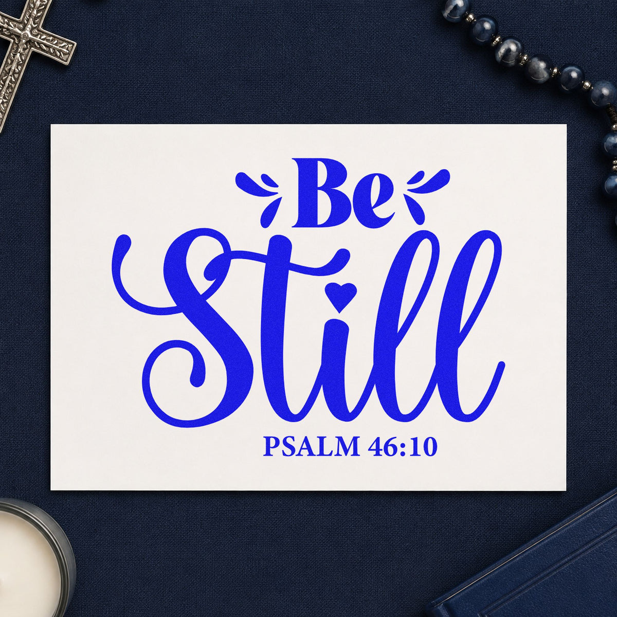 Be Still craft stamp in blue ink on cardstock, an easy option for canvas pillow covers.