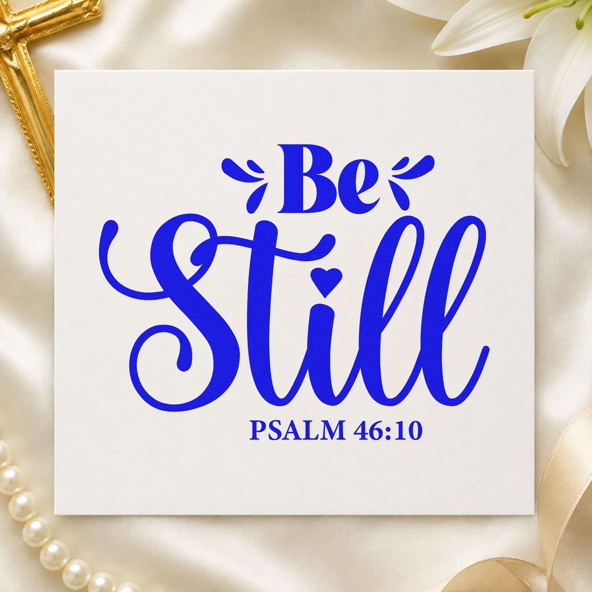 Be Still craft stamp imprinted in blue ink on paper, a design suited to nursery door signs.