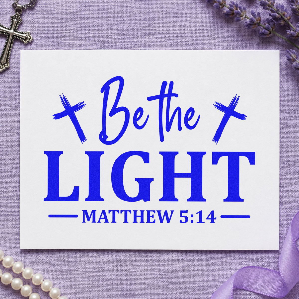 Be the Light Crosses craft stamp imprinted in blue ink on paper, a design suited to christmas eve favors.