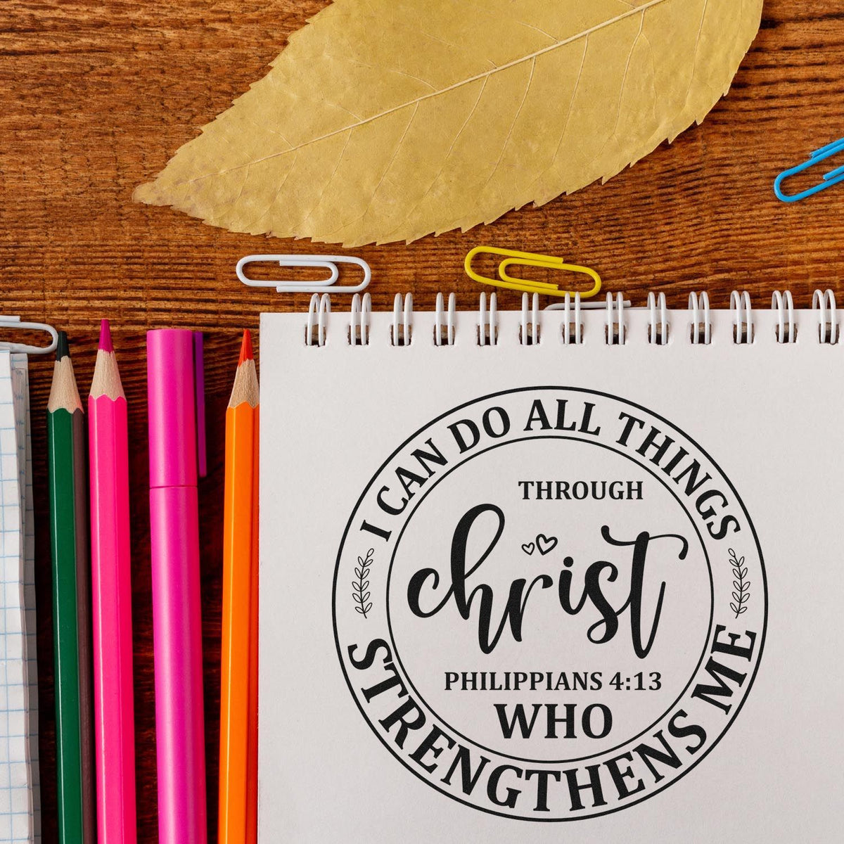 Christ Strengthens Me Circle Premium Wooden Stamp - Vintage Pro imprint stamped in brown ink. A circular design reads "I can do all things through Christ who strengthens me," with Philippians 4:13.