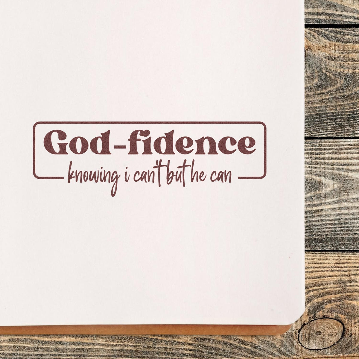 Burgundy faith-based stamp and seal reading God-fidence knowing I can't but he can on white paper.