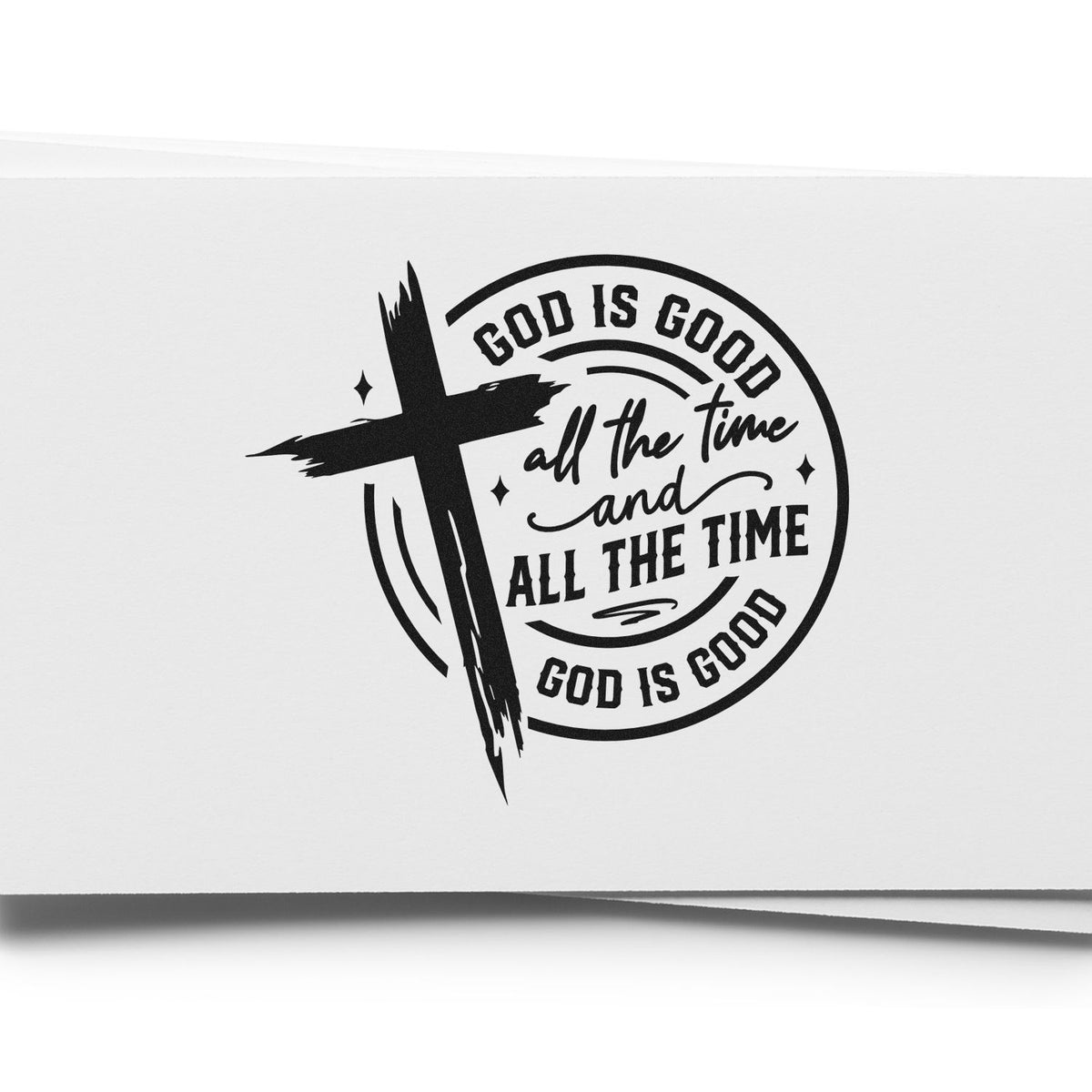 Black stamp seal design with brushstroke cross and circular text God Is Good All the Time on white background.