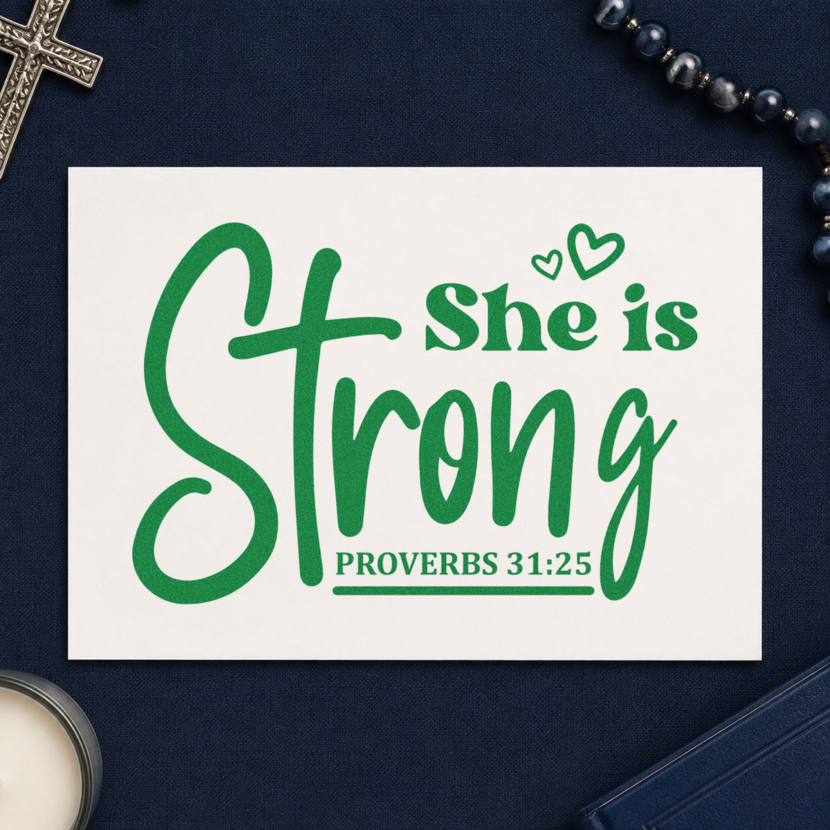 She Is Strong Cross Script craft stamp imprint in green ink on a handmade project, one idea being postpartum care kits.
