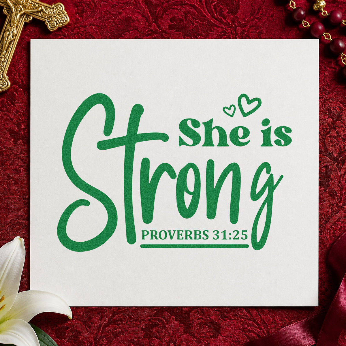 She Is Strong Cross Script craft stamp imprint in green ink on a handmade project, one idea being framed bedroom art.