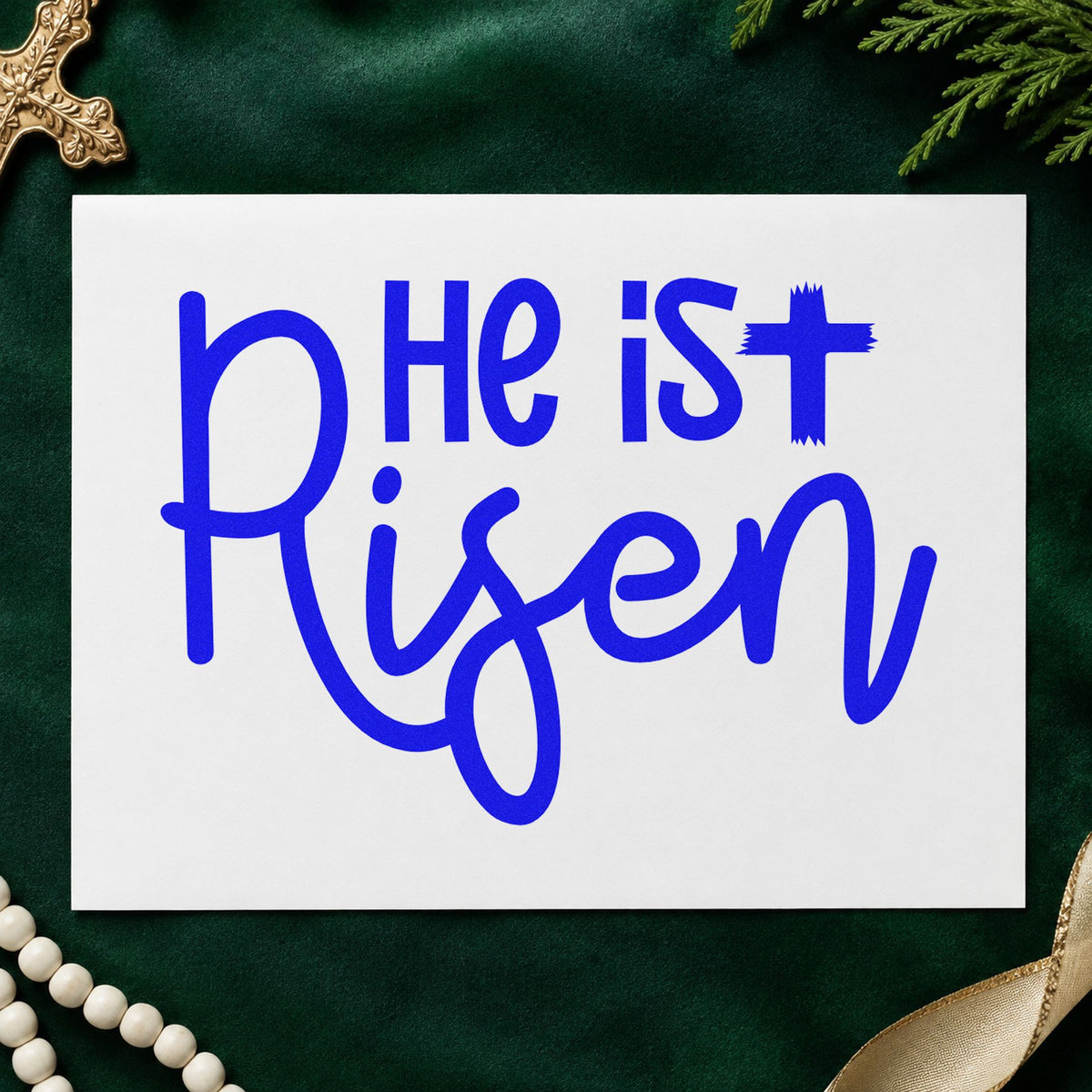 He Is Risen Script craft stamp imprinted in blue ink on paper, a design suited to sunrise service programs.