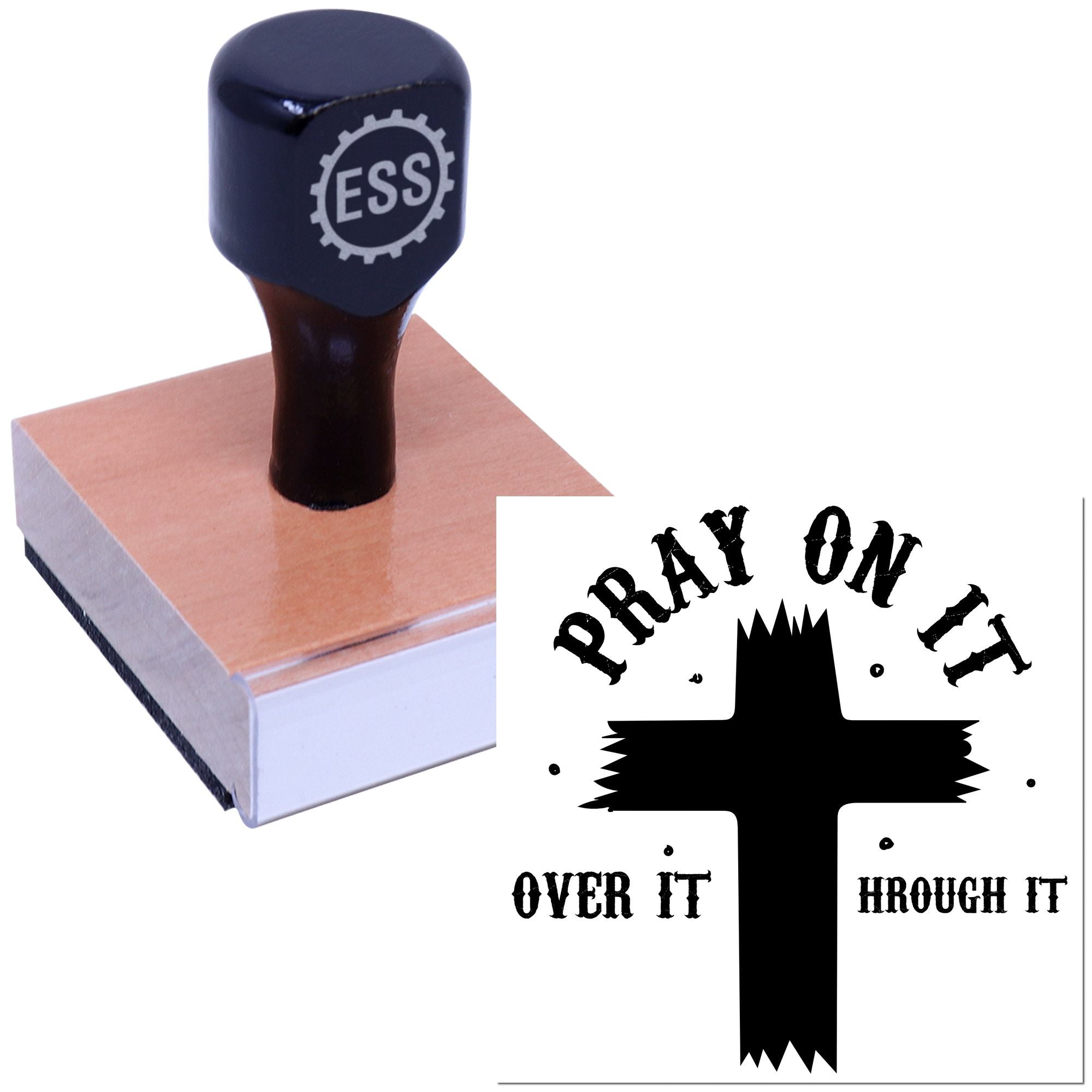 Dark blue ESS rubber stamp on a pink wooden block beside a black Pray on It seal graphic with cross.