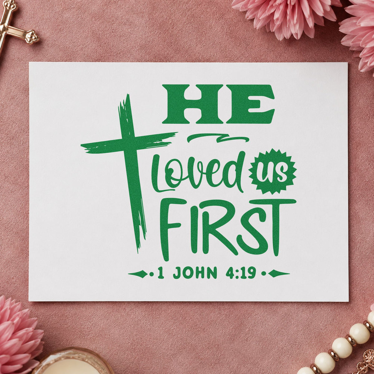 He Loved Us First craft stamp imprint in green ink on a handmade project, one idea being wedding favor tags.