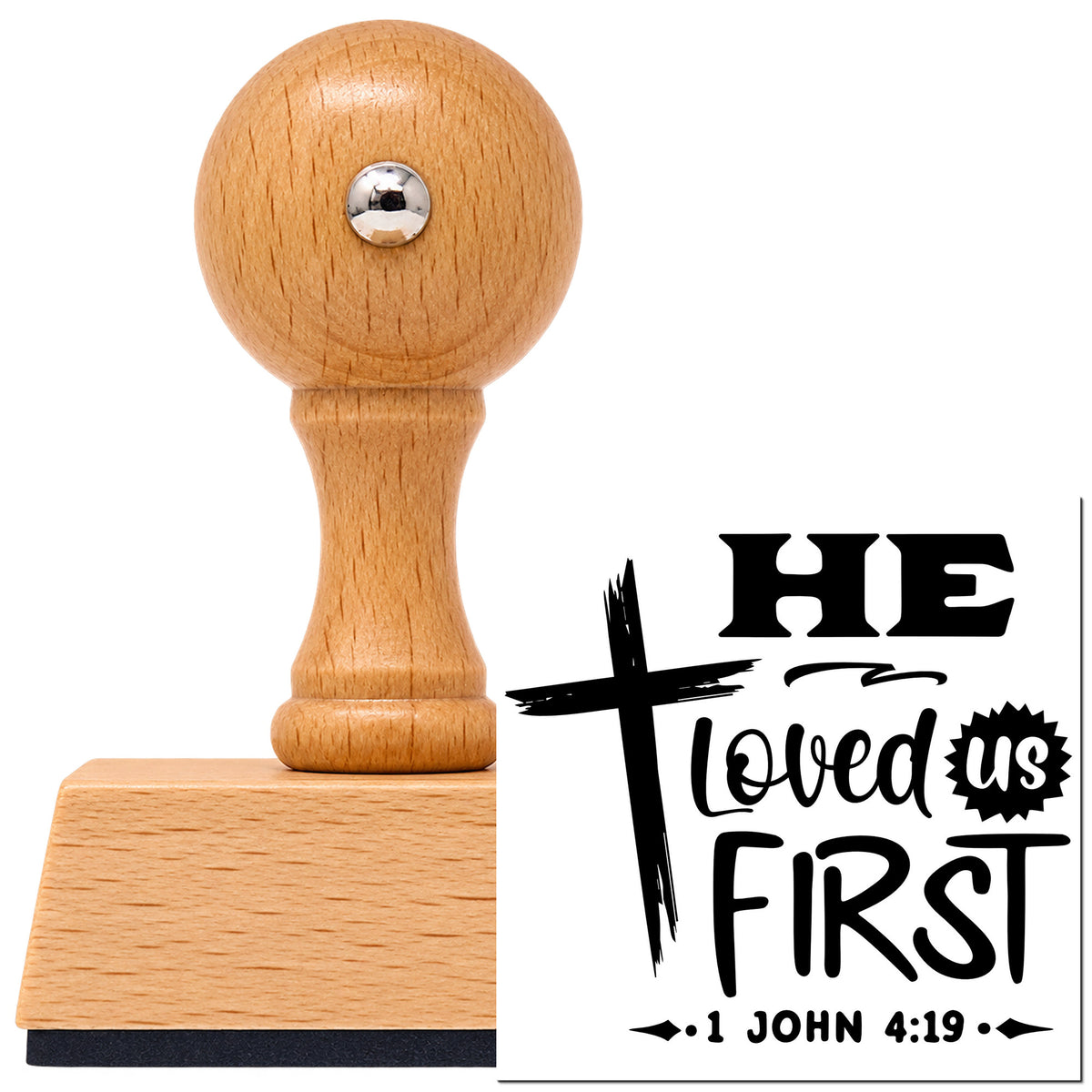 Vintage Pro beech wood stamp with a round knob handle, shown with its black He Loved Us First imprint on white.