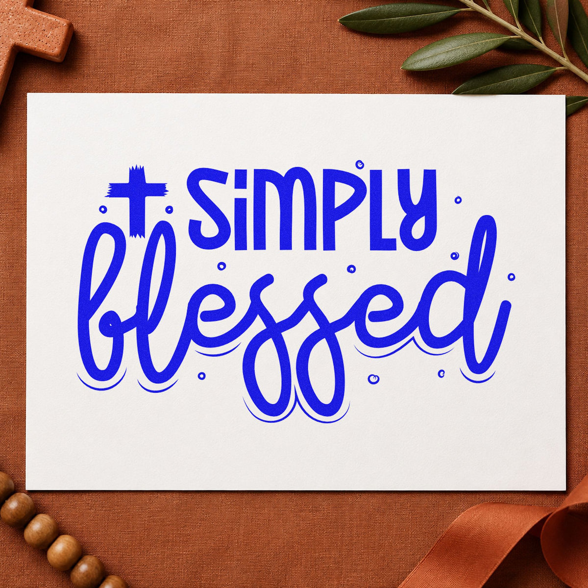 Simply Blessed Cross craft stamp in blue ink on cardstock, an easy option for kraft gift bags.