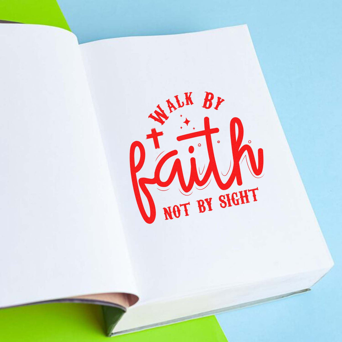 Red Walk by Faith rubber stamp on open white pages with blue and green background, seal-style religious product.