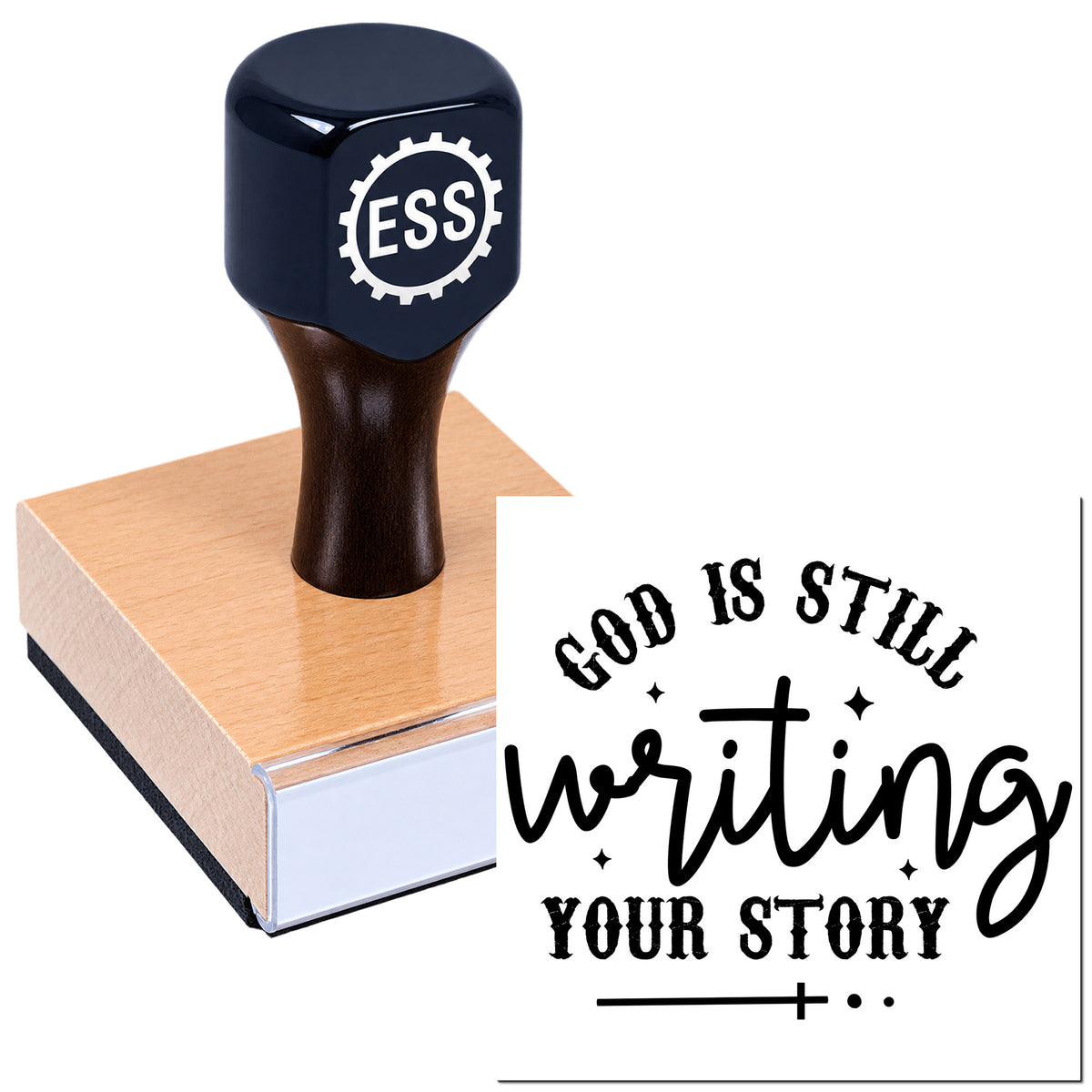 Navy ESS rubber stamp on a wooden base, creating a black seal reading "God is Still Writing Your Story."