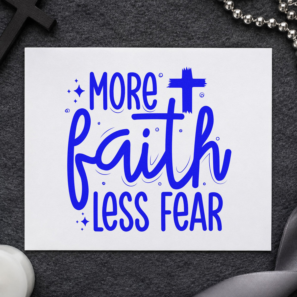 More Faith Less Fear craft stamp imprinted in blue ink on paper, a design suited to therapy tote bags.
