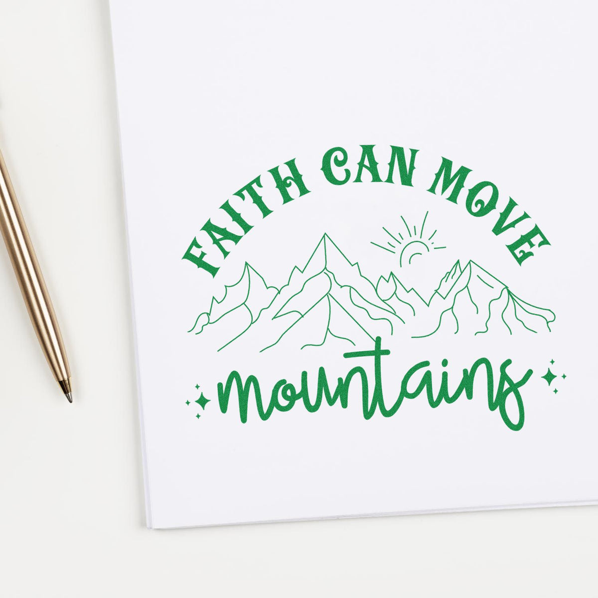 Green Faith can move mountains rubber stamp seal with mountain peaks and sunrise on white paper