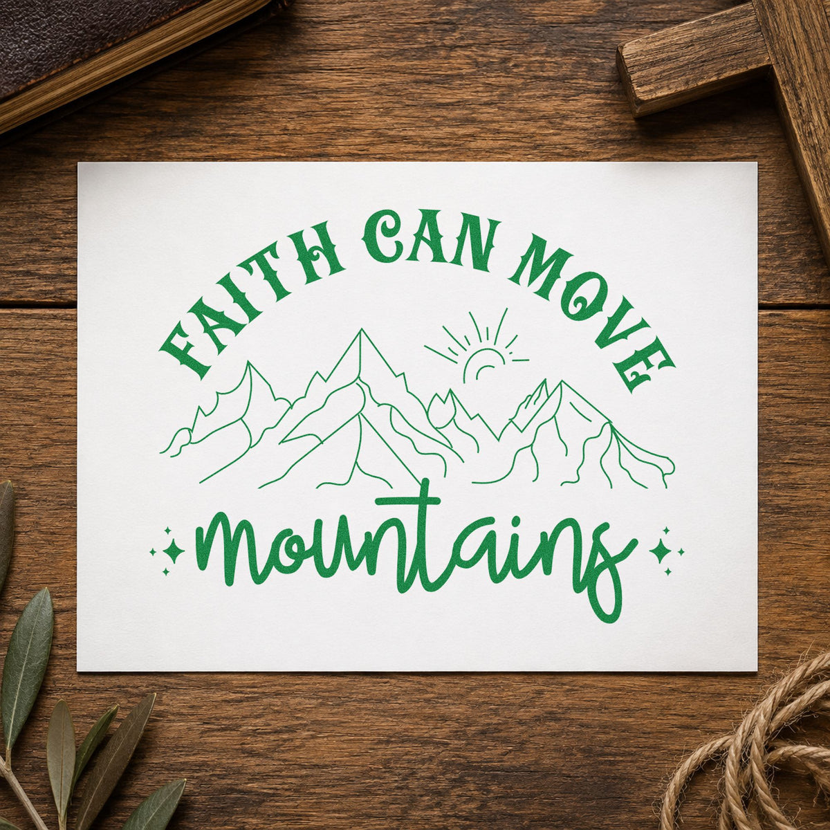Faith Can Move Outlined Mountains craft stamp imprint in green ink on a handmade project, one idea being trail journal covers.