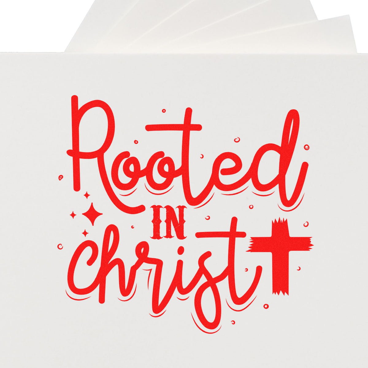 Red Rooted in Christ stamp-and-seal design with cross on white paper.