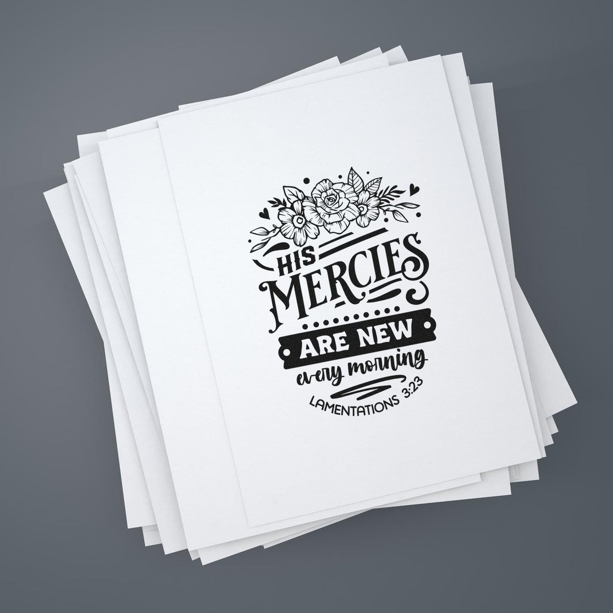 Stacked white stamp and seal sheets with black floral scripture design reading His mercies are new every morning.