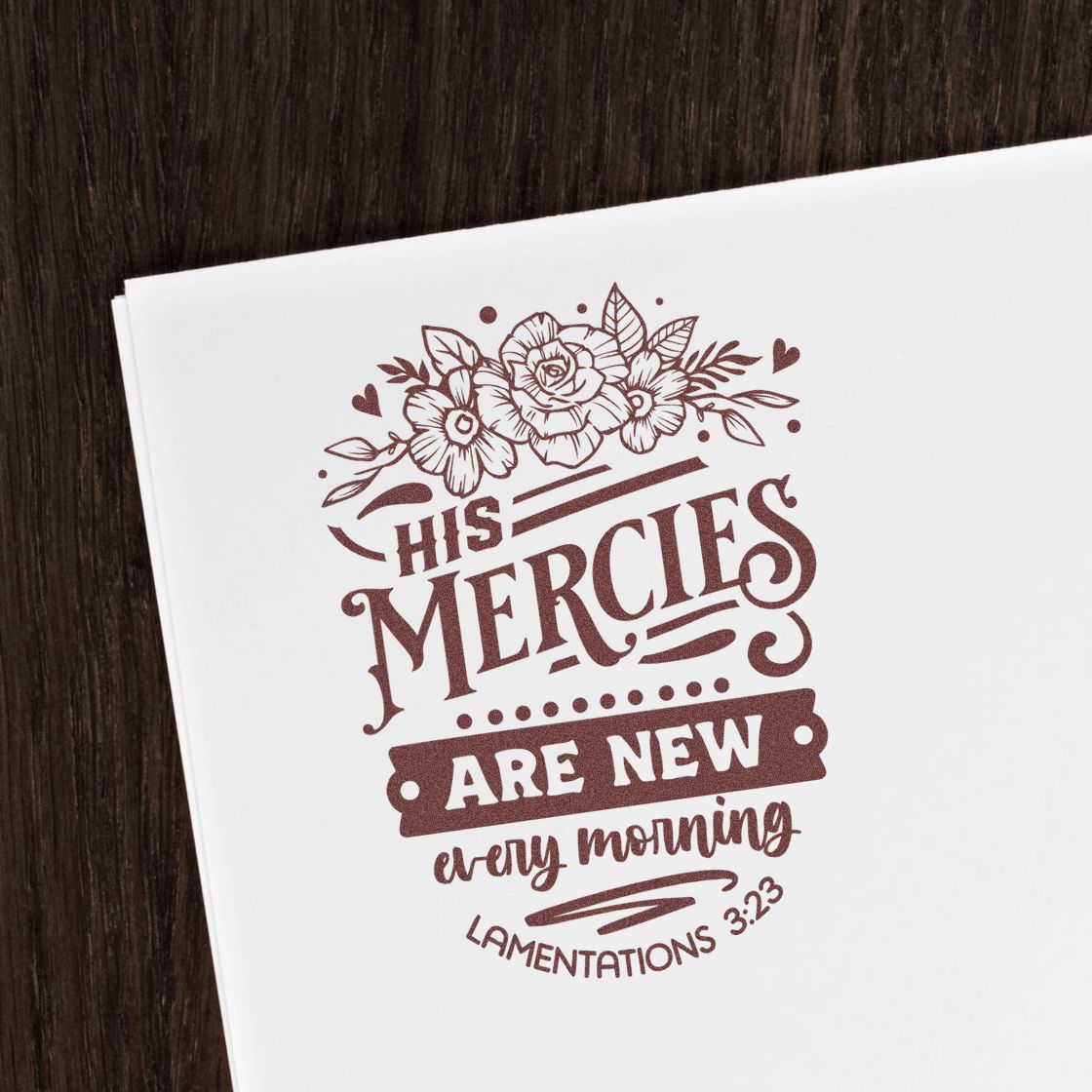 Brown floral rubber stamp/seal design on white paper reading His mercies are new every morning with Lamentations 3:23.