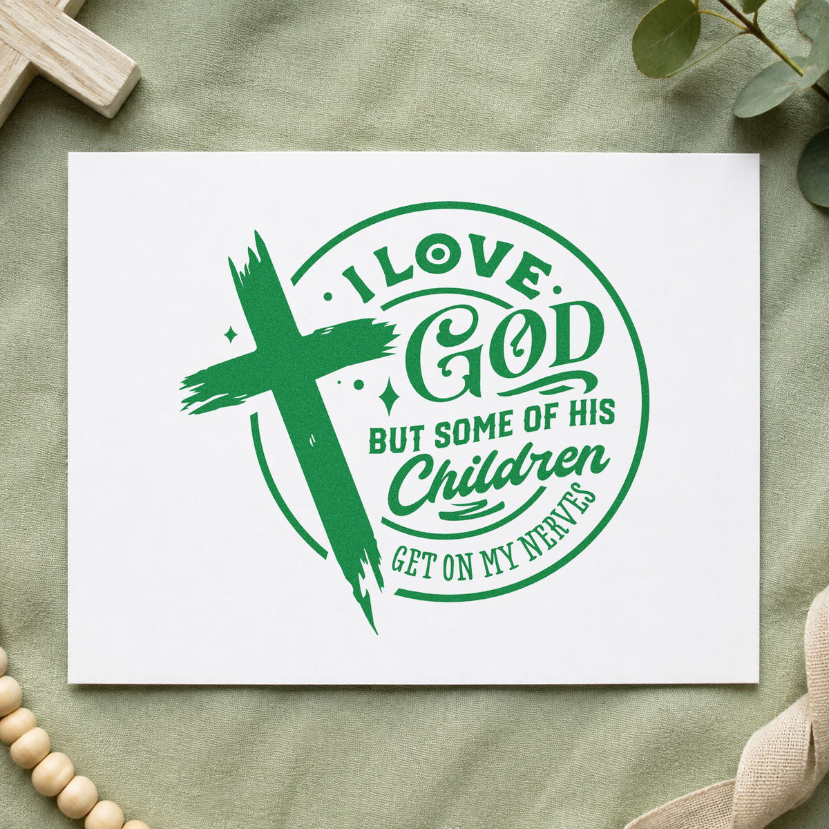 I Love God but His Children craft stamp imprint in green ink on a handmade project, one idea being coffee mug boxes.