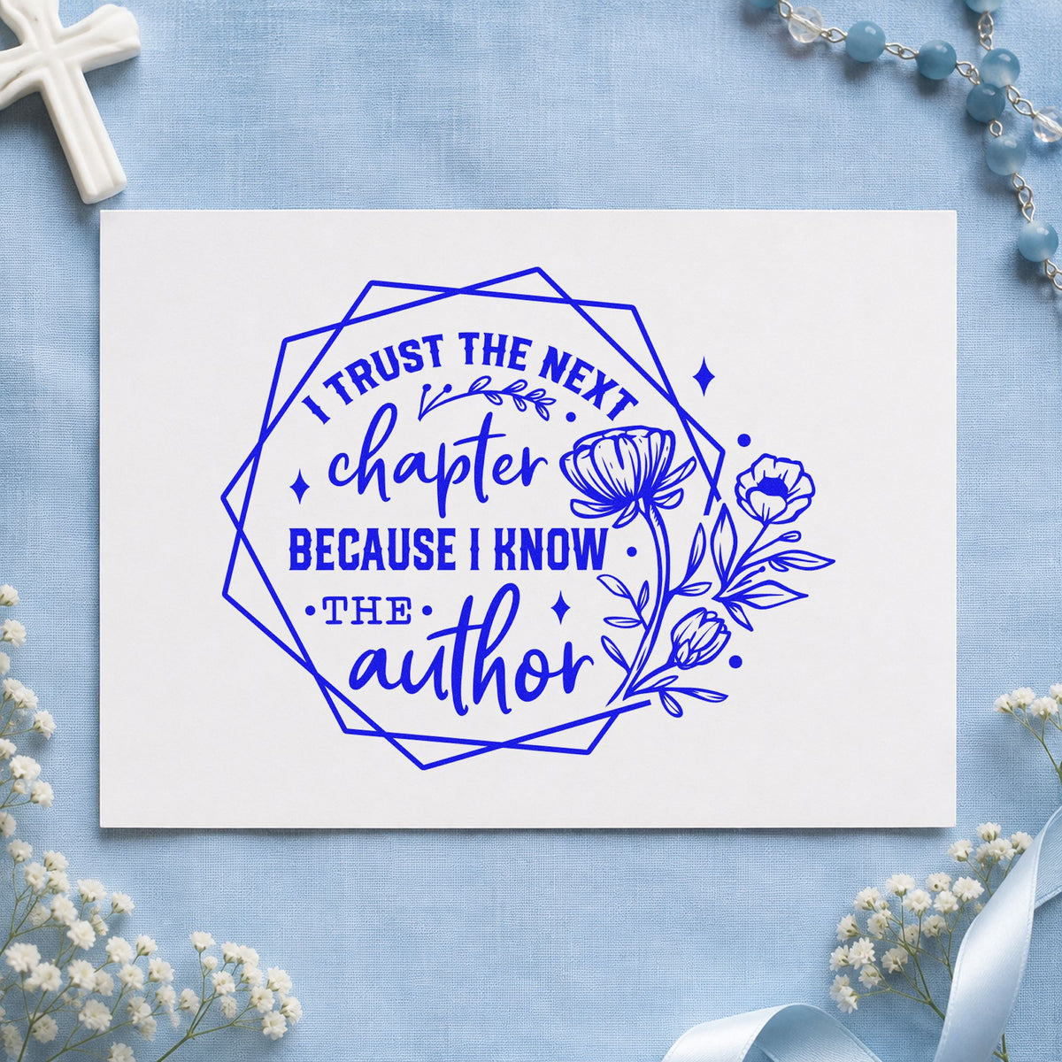 Trust the Next Chapter Floral craft stamp imprinted in blue ink on paper, a design suited to author signing seals.