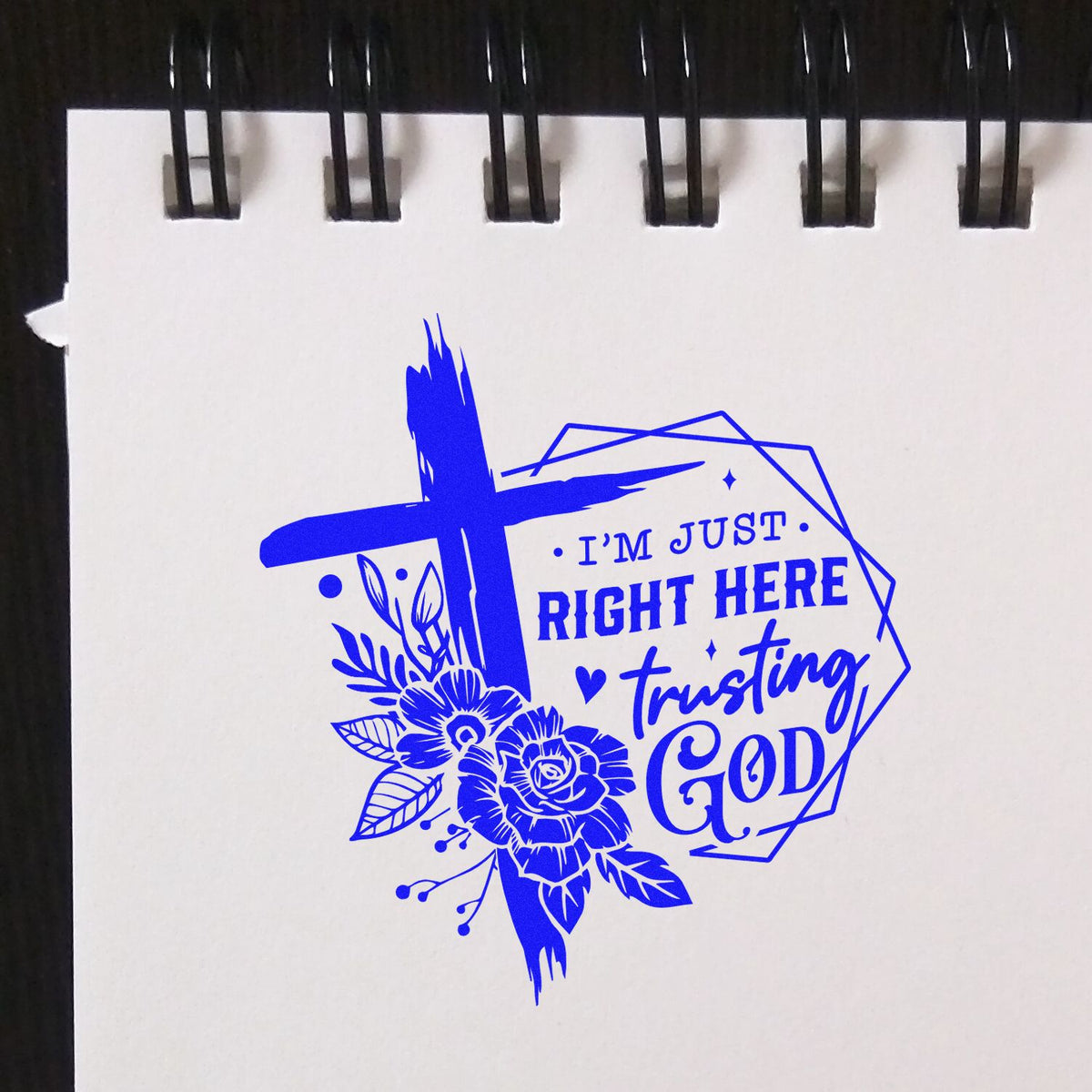 Blue faith stamp/seal design on white paper with floral cross and text Im just right here trusting God.