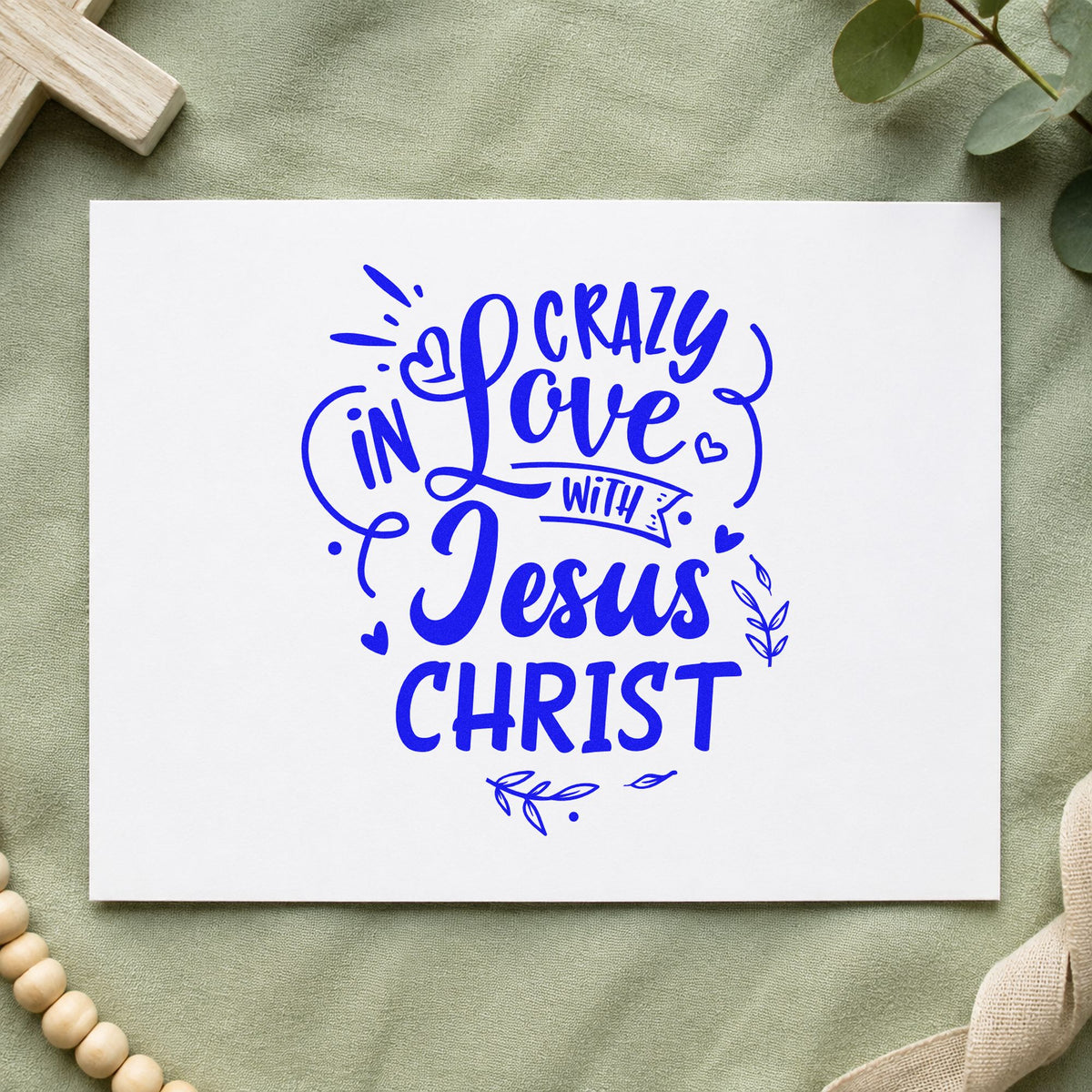 Crazy in Love with Jesus Christ craft stamp imprinted in blue ink on paper, a design suited to bakery box seals.