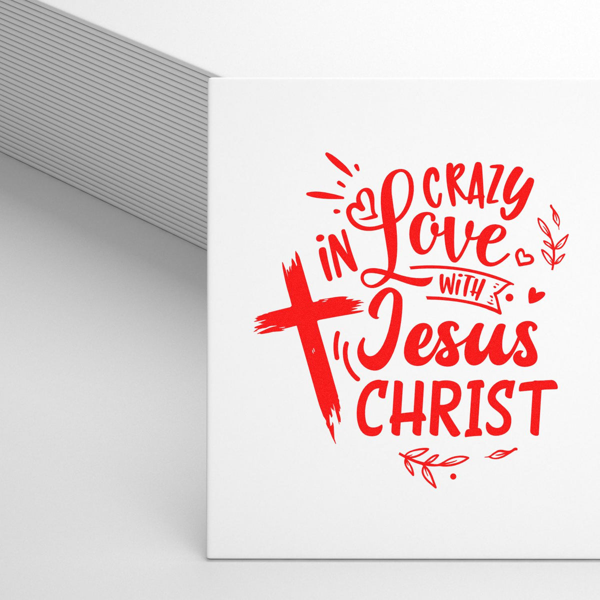 Red stamp and seal design with cross and heart, reading Crazy in Love with Jesus Christ on a white background.