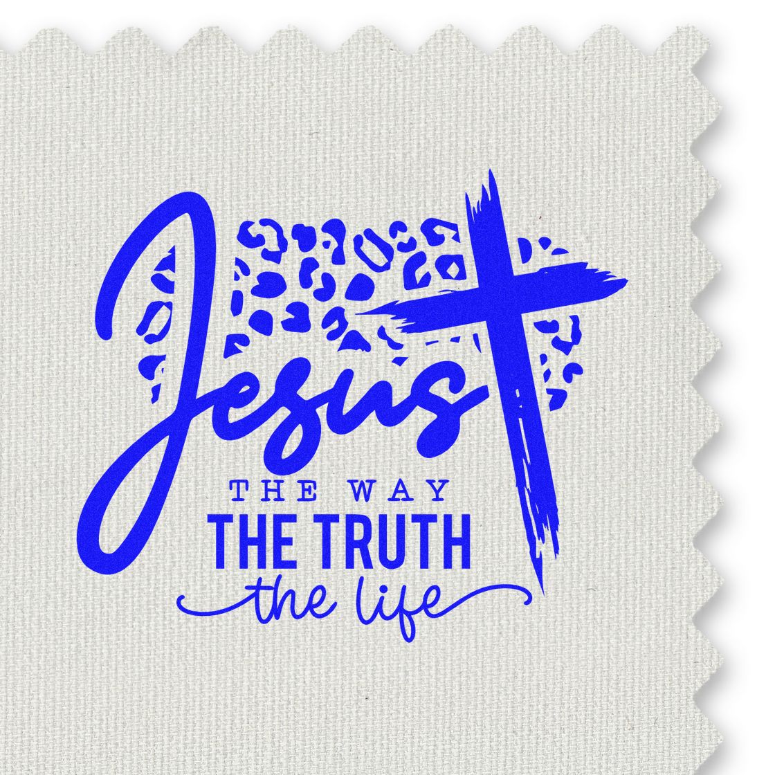 Blue stamp seal with Jesus the way the truth the life and a brush-style cross on white textured fabric.