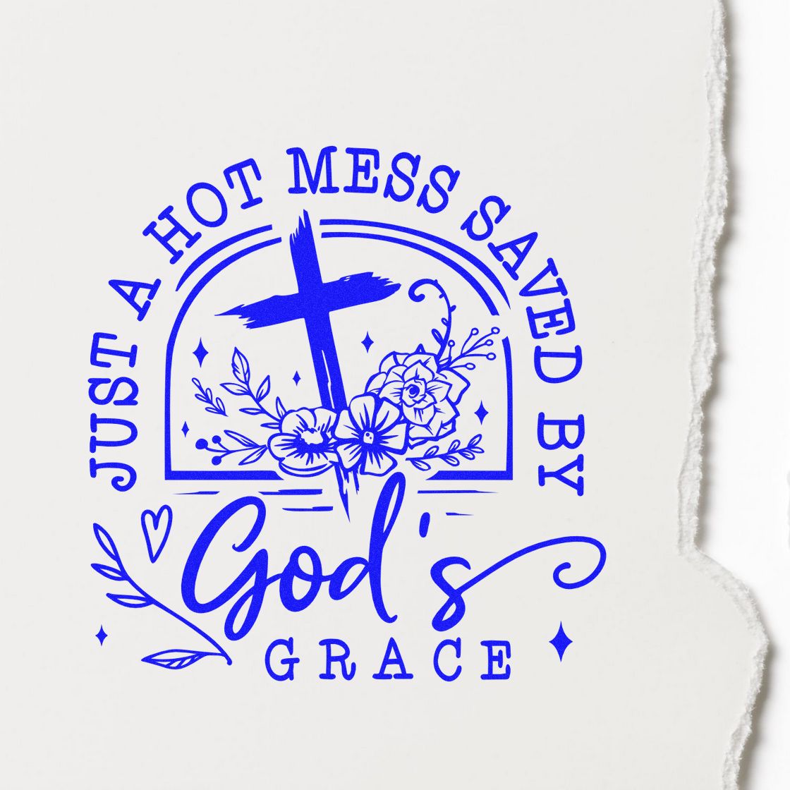 Blue stamp-and-seal design on white paper with cross, flowers, and Just a hot mess saved by Gods grace text.