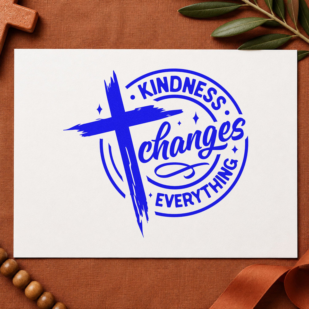 Kindness Changes Everything craft stamp in blue ink on cardstock, an easy option for buddy bench tees.