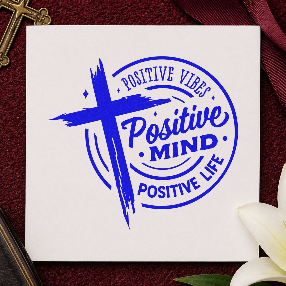 Positive Mind Positive Life craft stamp imprinted in blue ink on paper, a design suited to studio window clings.