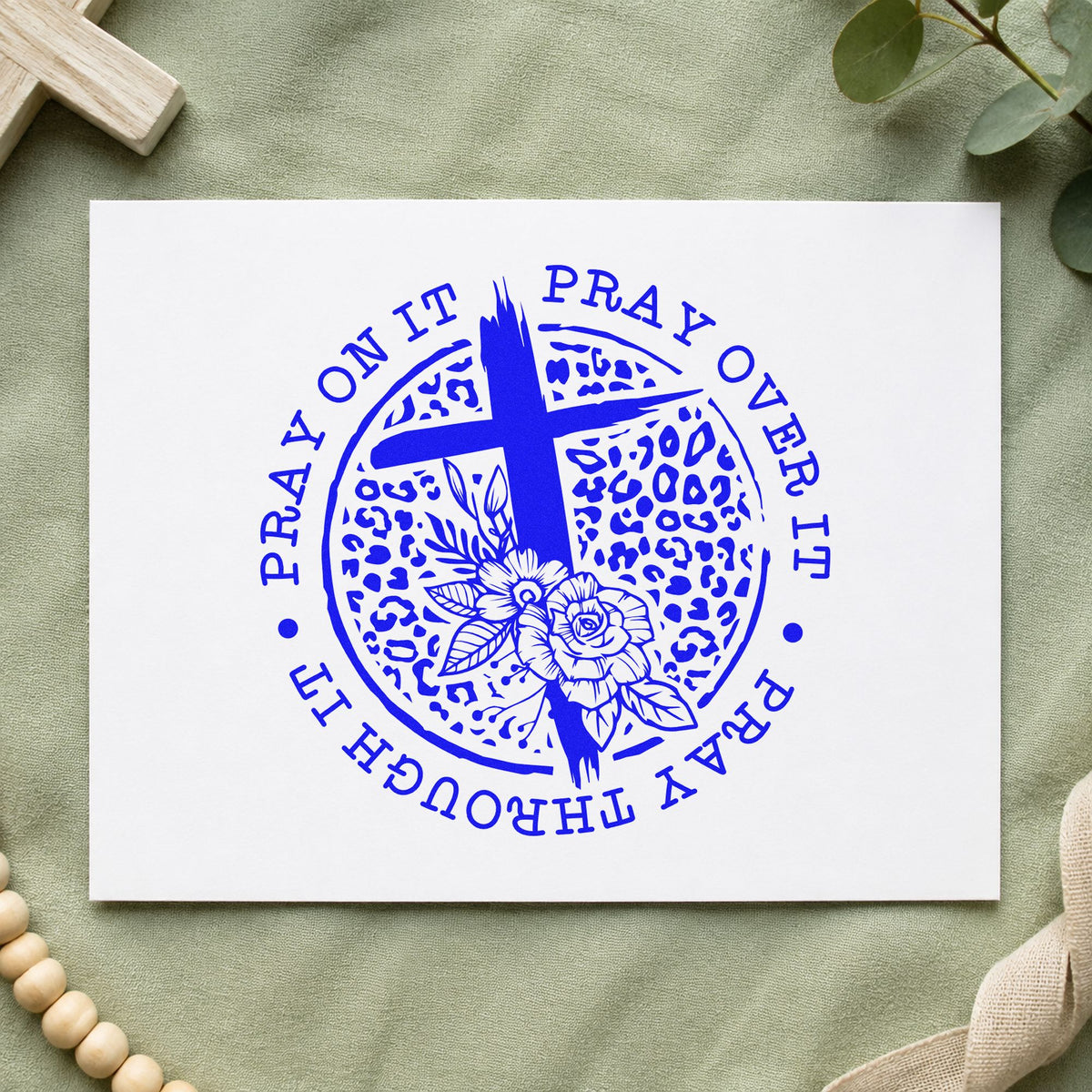 Pray Leopard Floral Circle craft stamp imprinted in blue ink on paper, a design suited to candle vessel labels.