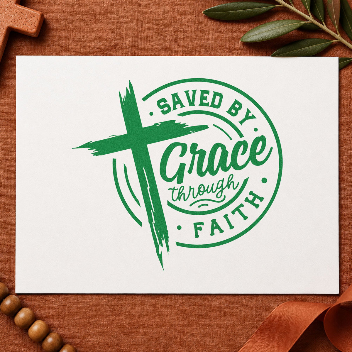 Saved by Grace Through Faith craft stamp imprint in green ink on a handmade project, one idea being catechism class pages.