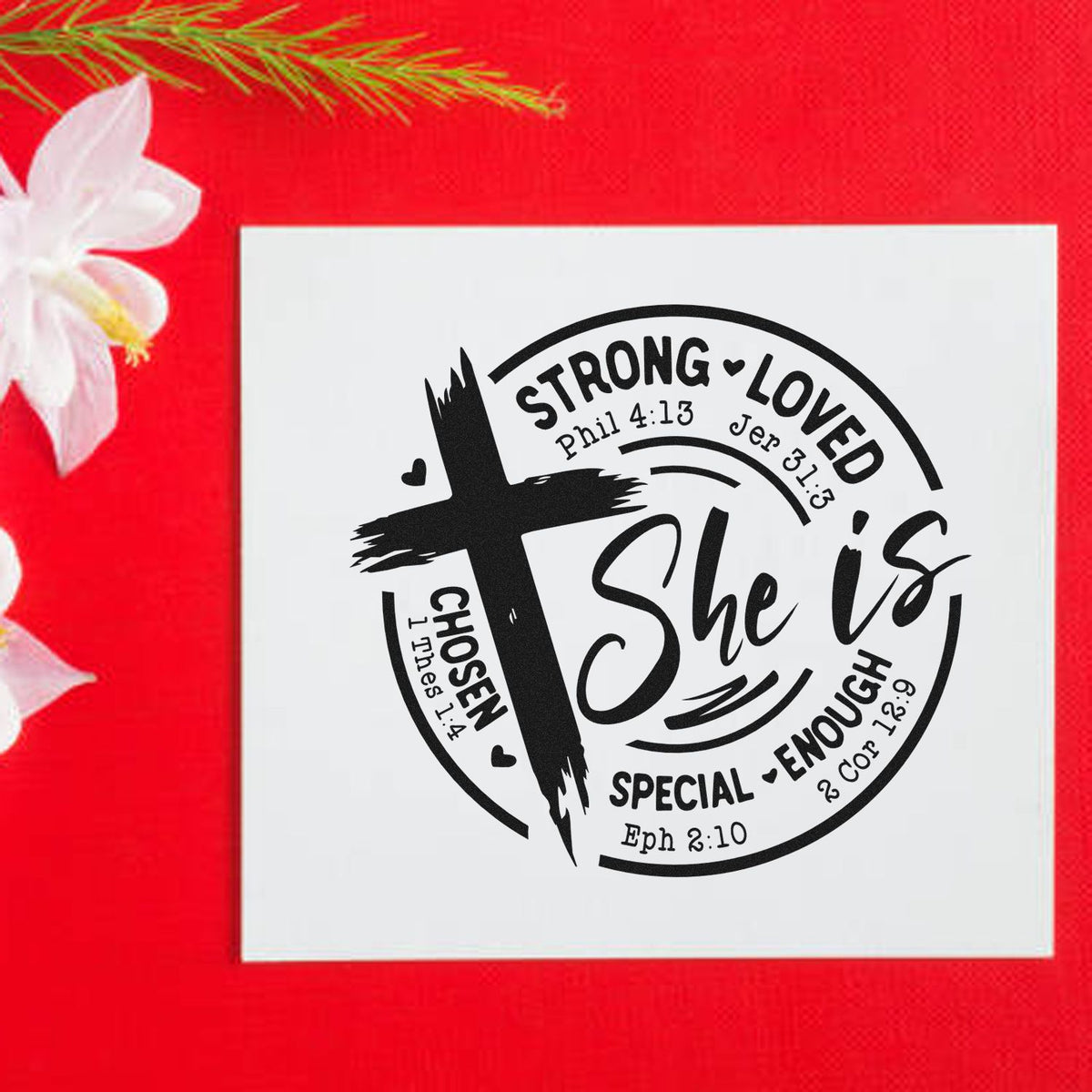 Black Christian seal stamp on white square card, reading She is Strong, Loved, Chosen, Special, Enough, on bright red background.
