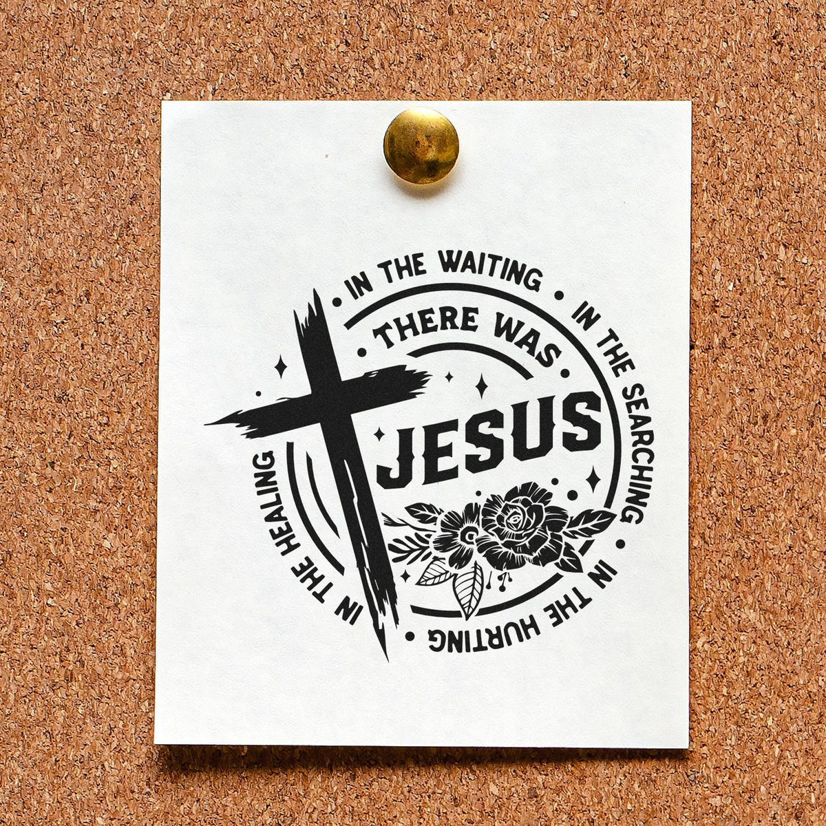 Black Jesus healing stamp seal on white card pinned to a corkboard, with a cross, floral accents, and gold tack.