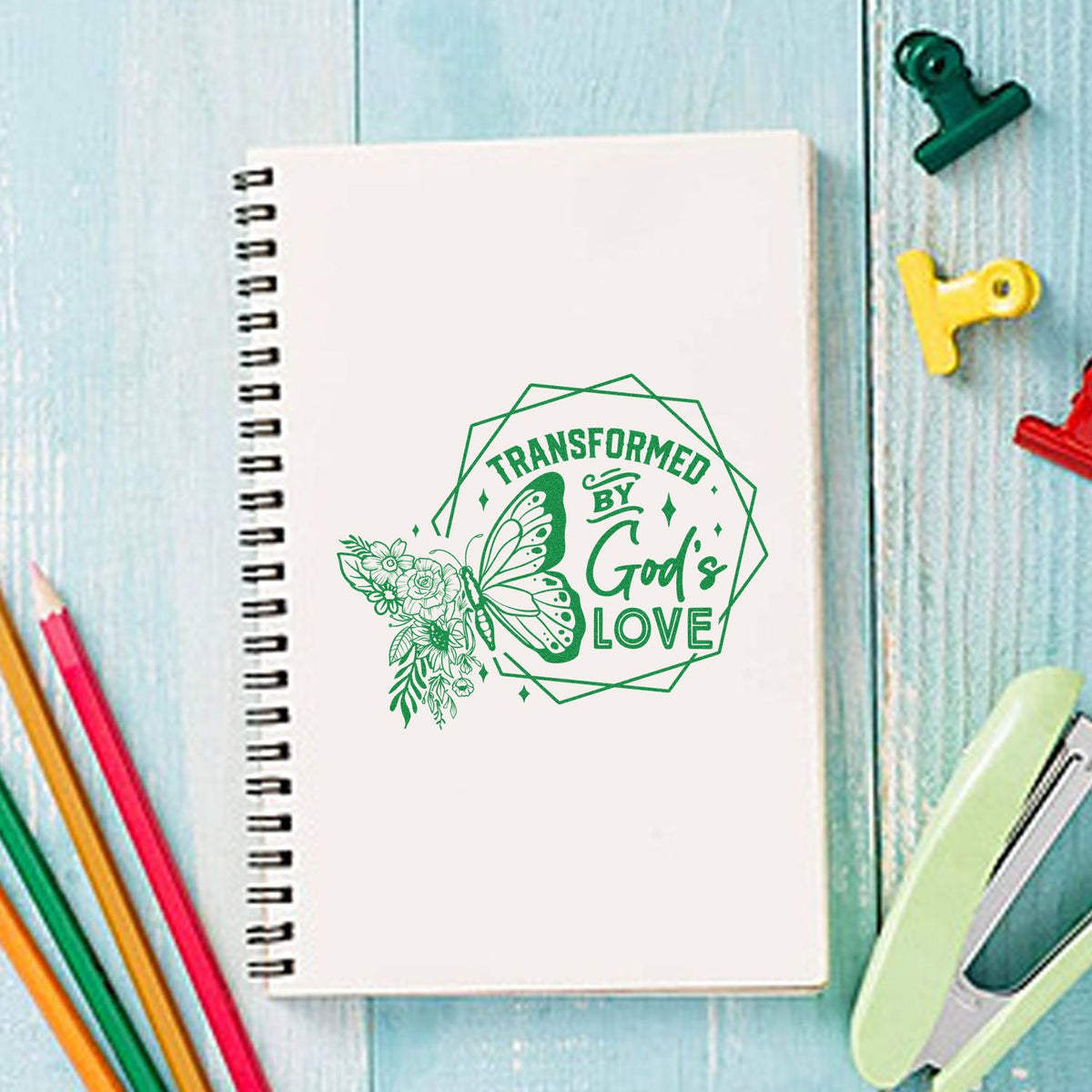 Transformed by God's Love rubber stamp shown in green ink, stamped for projects such as rebirth gift tags.