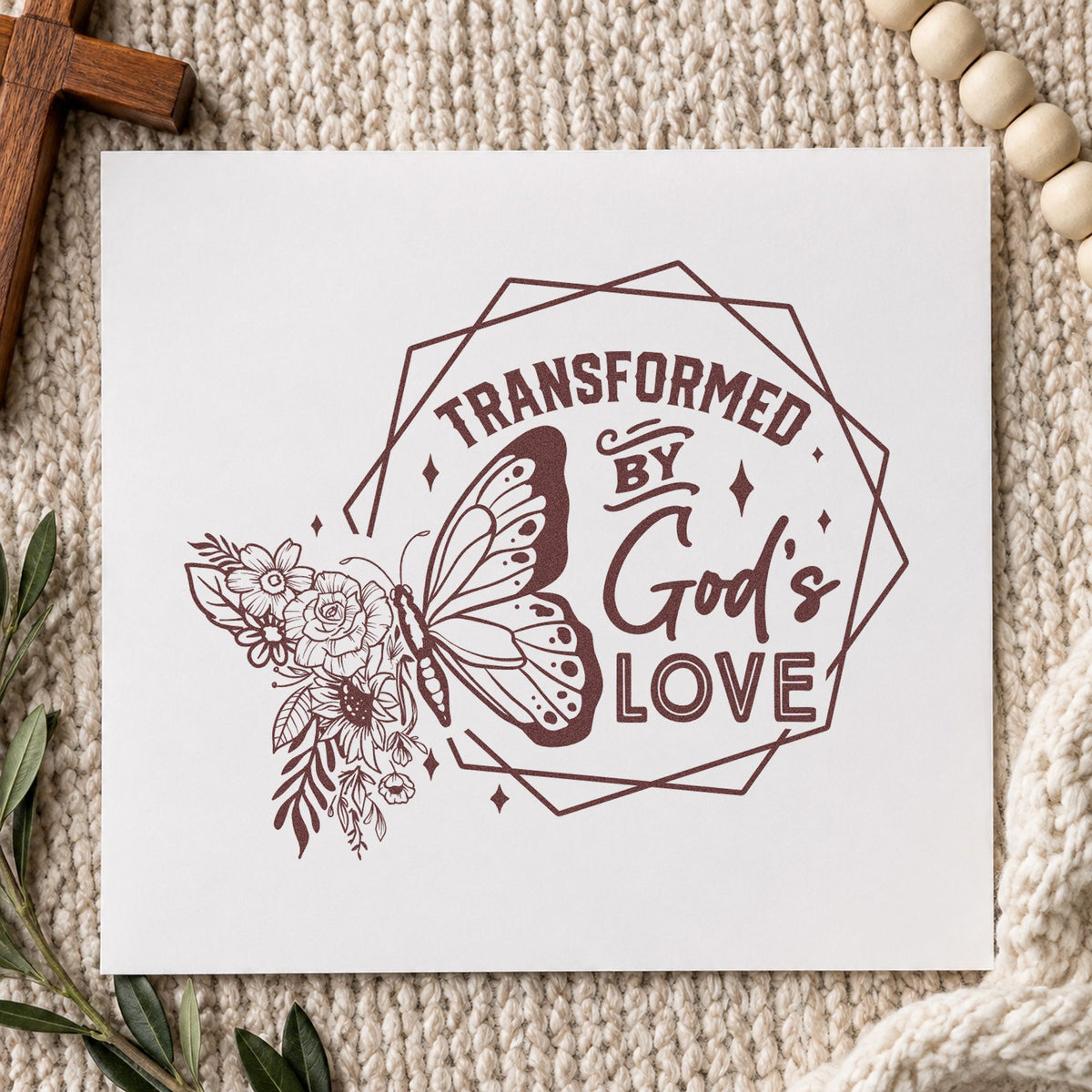 Transformed by God's Love rubber stamp printed in brown ink, ready for cocoon craft kits and similar paper crafts.