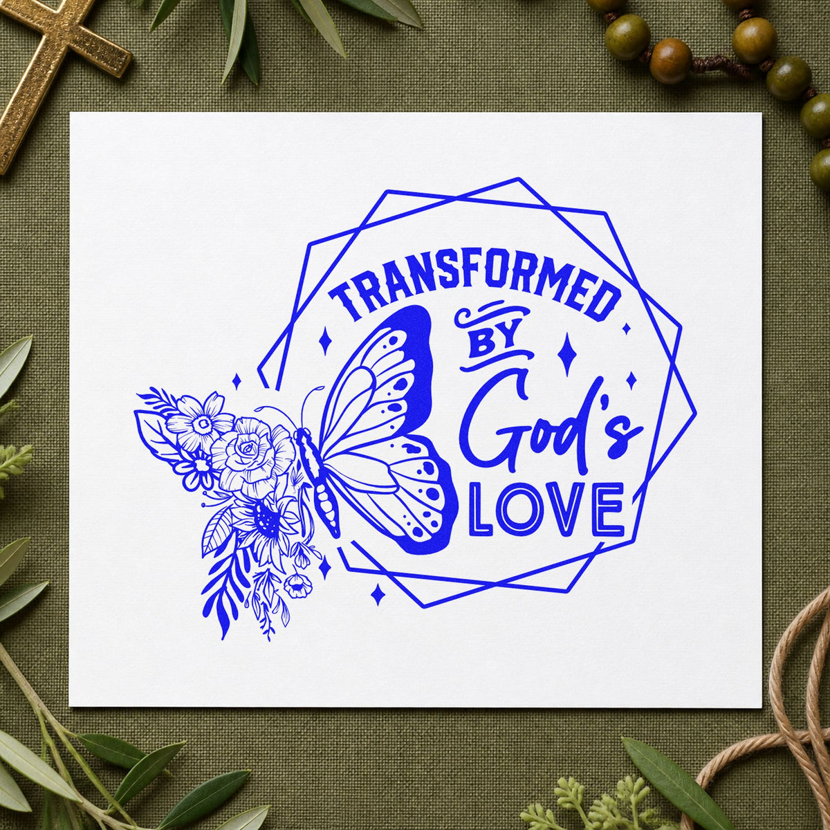 Transformed by God's Love craft stamp imprinted in blue ink on paper, a design suited to release ceremony labels.