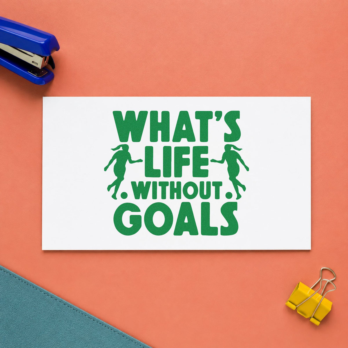 Life Without Goals Players craft stamp imprint in green ink on a handmade project, one idea being goal pun scrapbooks.