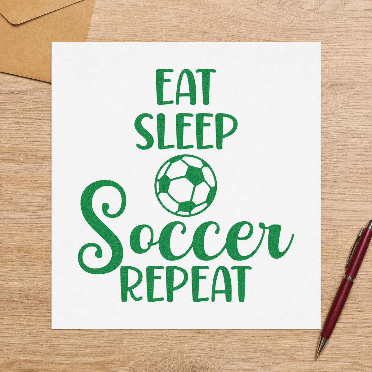 Eat Sleep Soccer Repeat craft stamp imprint in green ink on a handmade project, one idea being practice log pages.