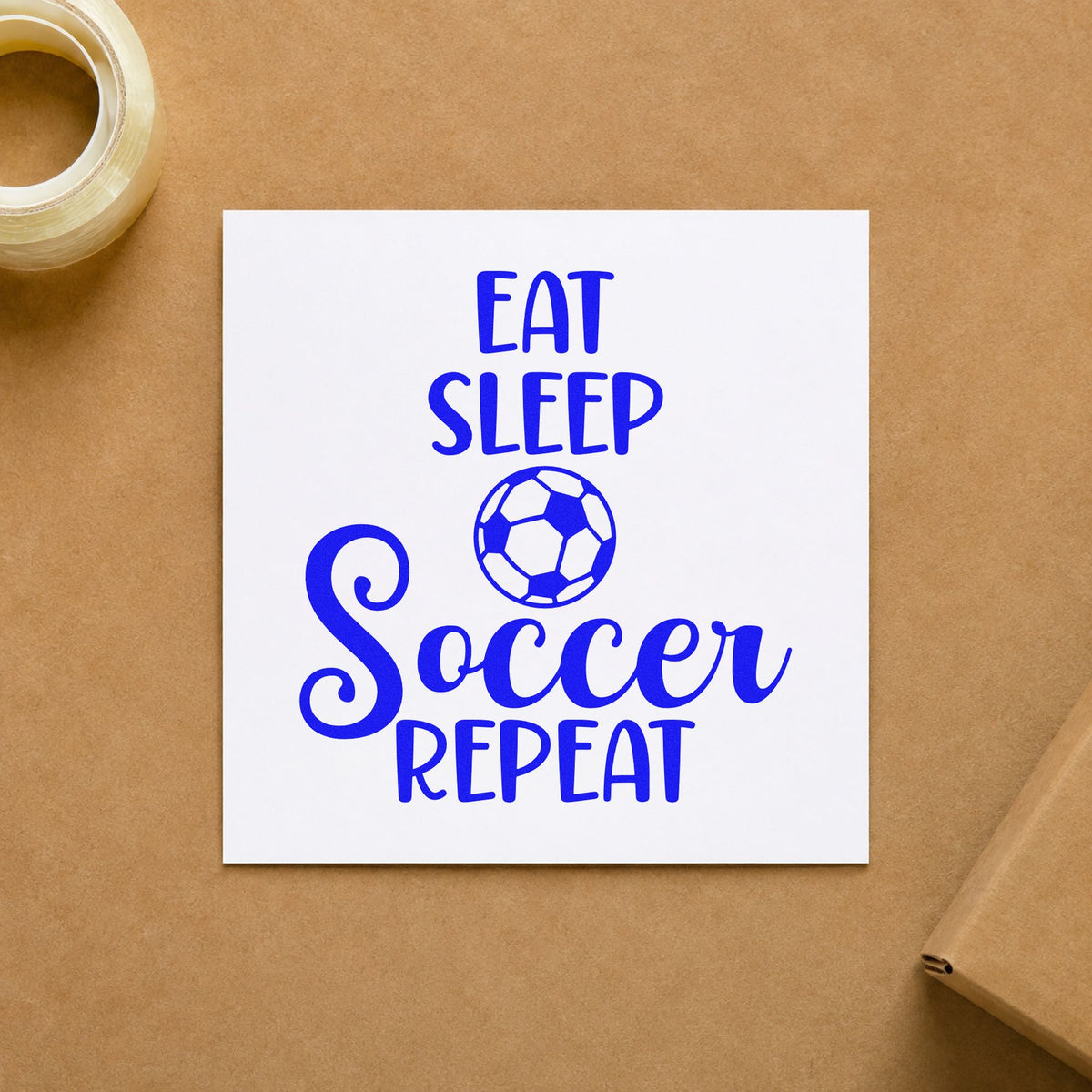 Eat Sleep Soccer Repeat craft stamp imprinted in blue ink on paper, a design suited to cereal jar labels.
